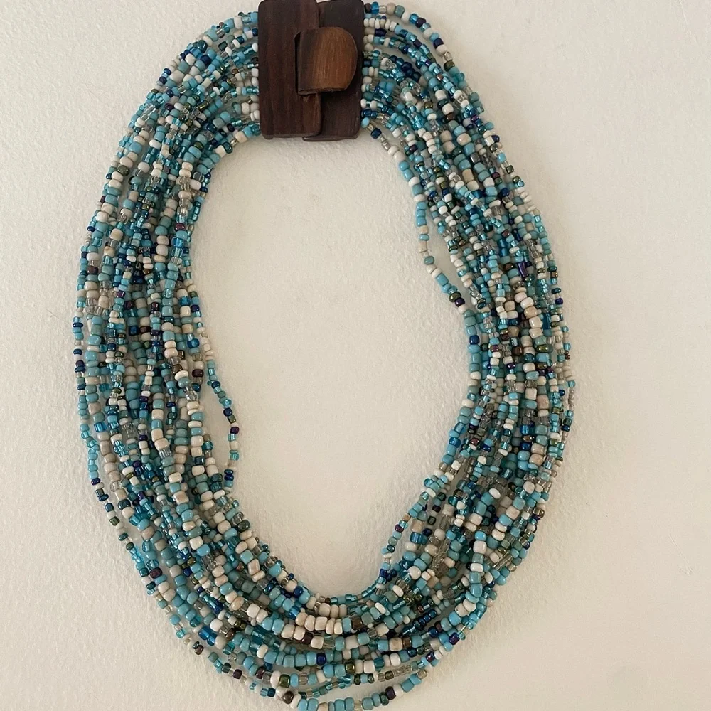 Unique Vintage Aqua Blue and White Beaded Necklace with carved wood clasp - Picture 3 of 9